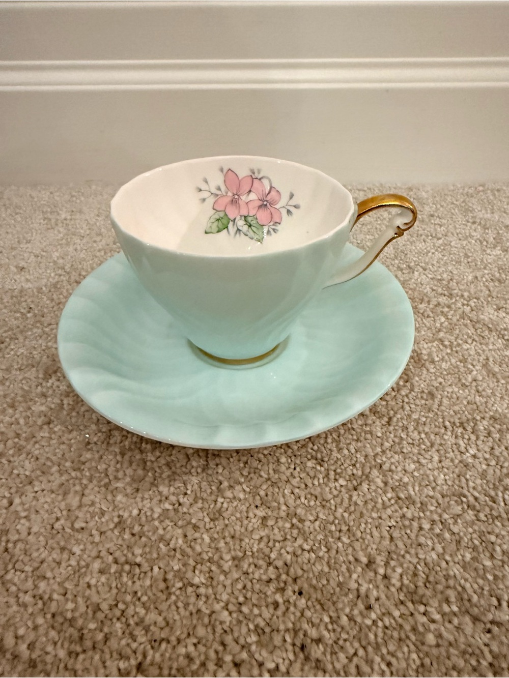 Elegant Mint Green Teacup and Saucer with Pink Floral Accent